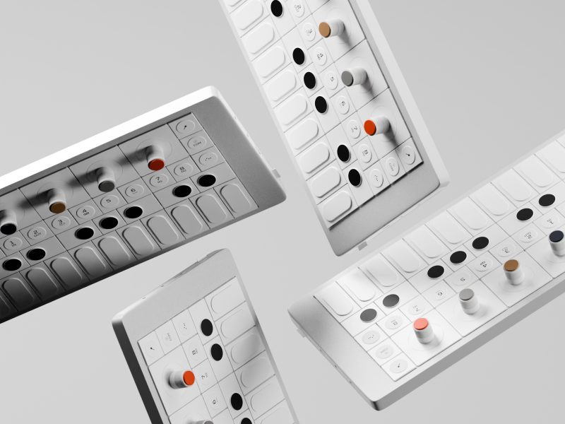 Four futuristic remote controls with sleek designs, featuring various buttons and a small digital screen, presented on a gray background at different angles. Stunning 3D Art Pieces You Need to See